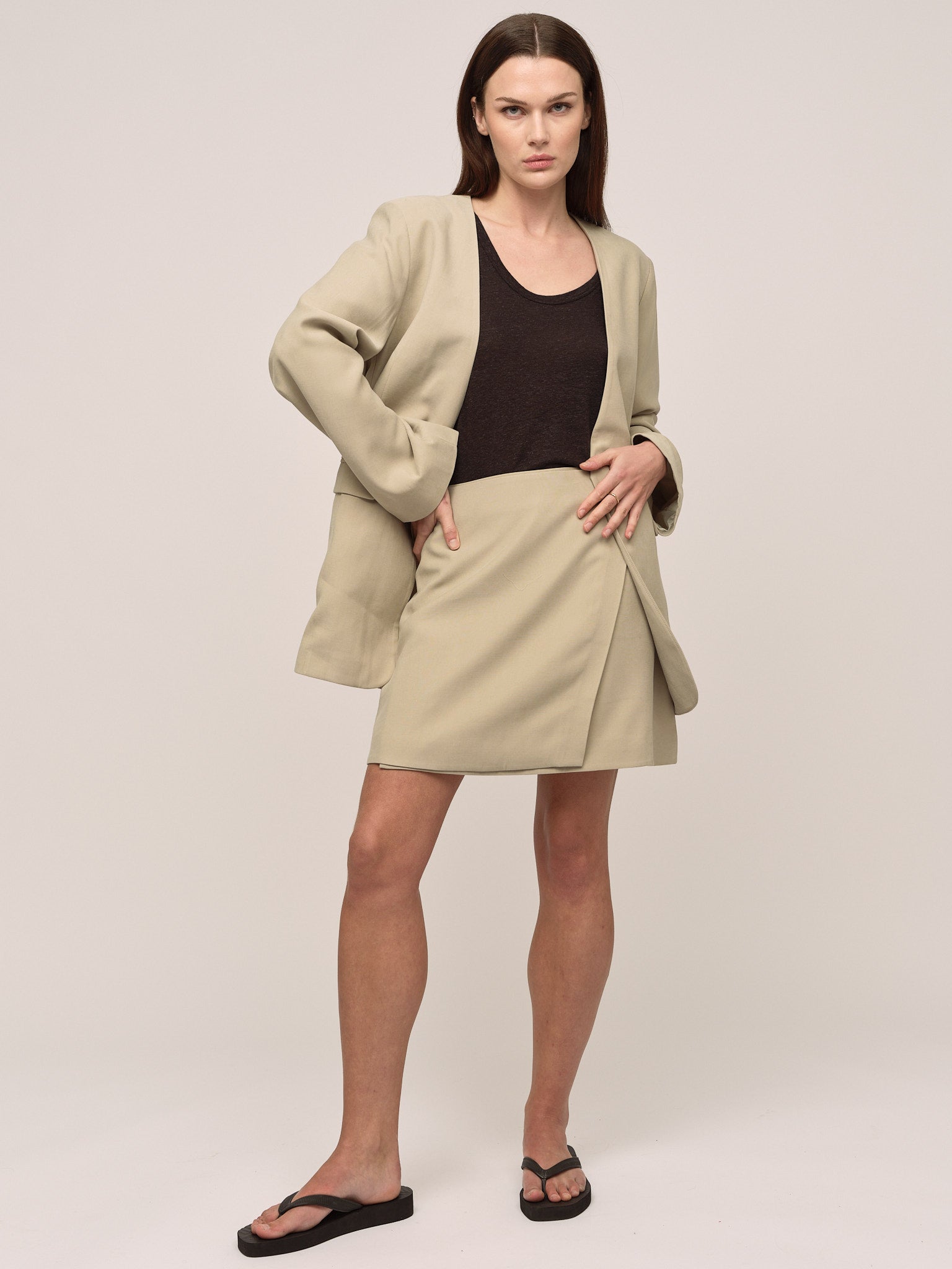 Beige blazer green skirt deals